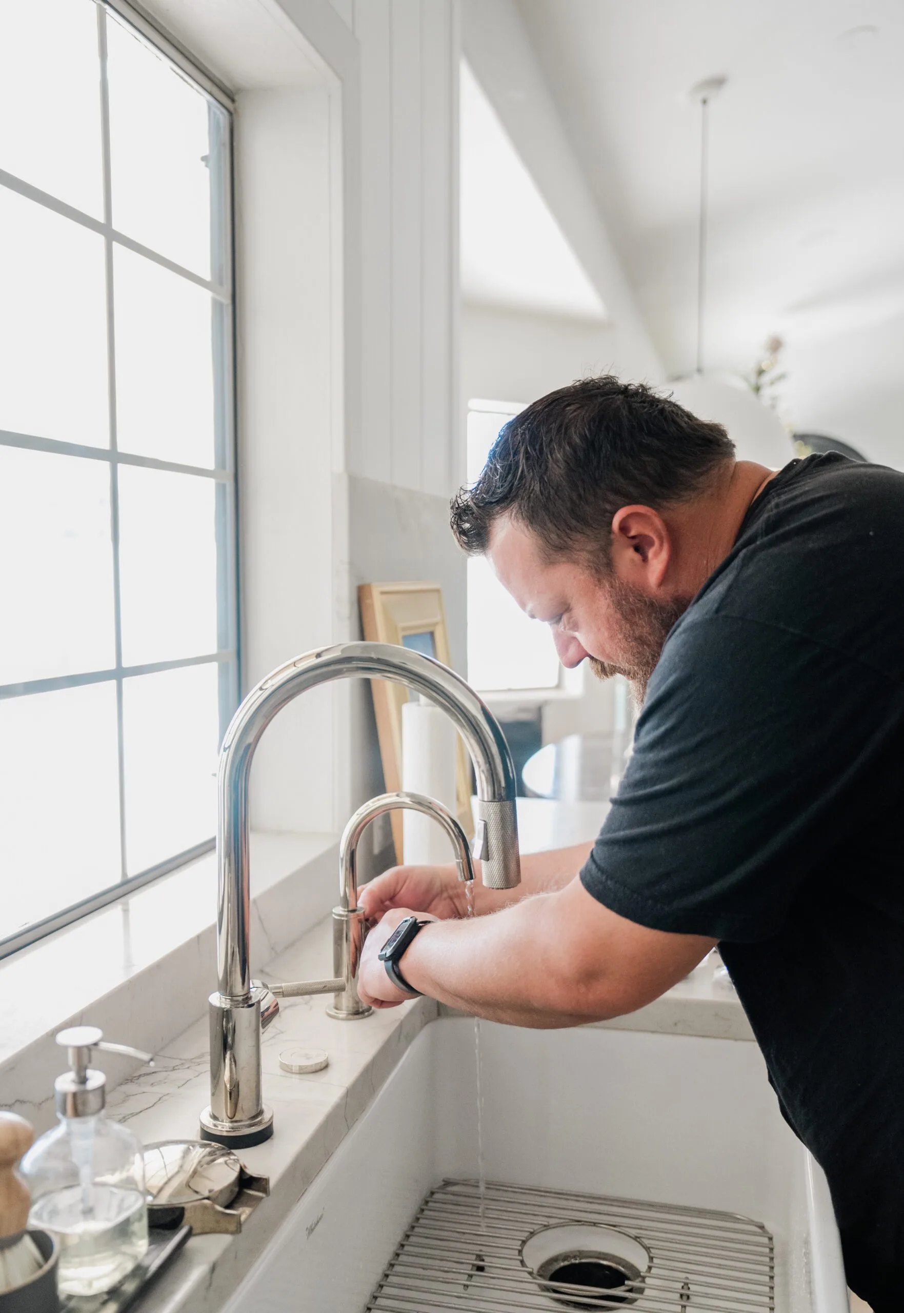 Plumber loading equipment ahead of an appliance installation job